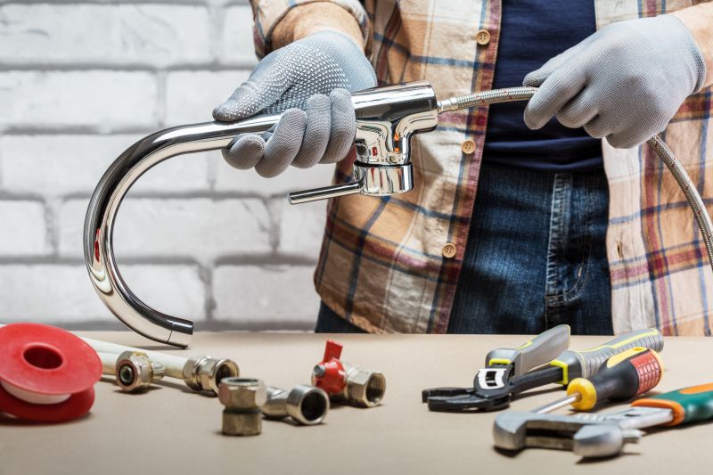 Handyman Fixing a Faucet